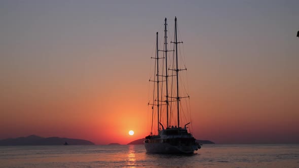 Video of Cruise Ship Sails Against a Background of Orange Sunset