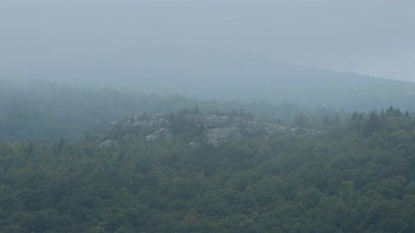 Lions Head rock formation seen through clouds from the Rohrbaugh Cliffs in the Dolly Sods Wilderness