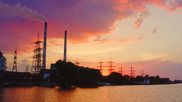 Industry against beautiful evening sky. Pollution of the environment.
