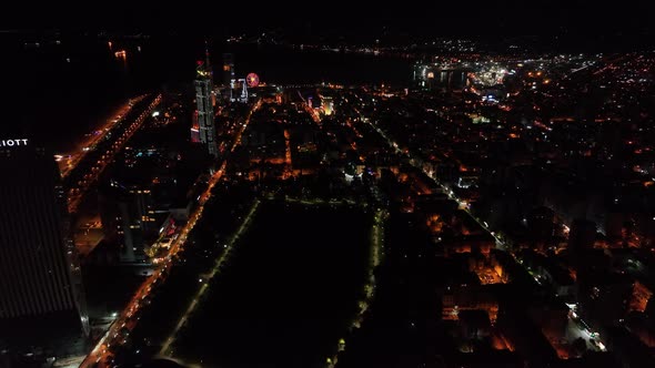 Top aerial view of beautiful lake in the center of Batumi at sunset. flying over 6 May park