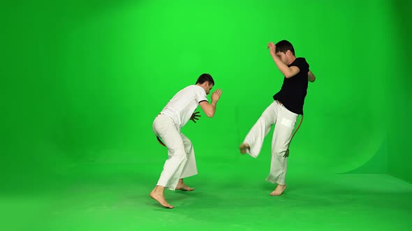 Two Man Are Practicing Capoeira on Chroma Key.