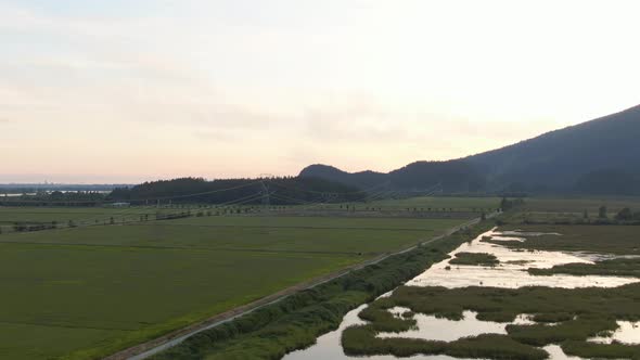 Beautiful Aerial Panoramic View of Canadian Mountain Landscape during a vibrant summer sunset. Taken