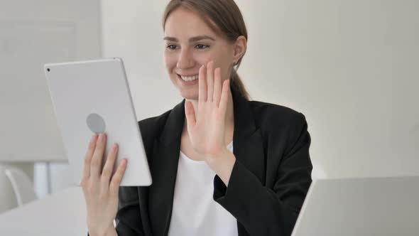 Online Video Chat on Tablet by Young Businesswoman