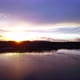 Hovering Over a Large and Big Lake at Sunset - VideoHive Item for Sale