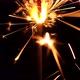 Burning sparkler close up on black background. Burning New Year sparklers. 4K UHD video - VideoHive Item for Sale
