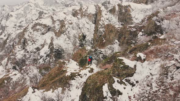 Couple Standing Excited Together In Scenic Winter Nature