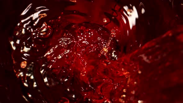 Super Slow Motion Shot of Pouring Red Wine Into Whirl at 1000 Fps