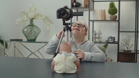 Happy Girl with Down Syndrome Filming on Camera