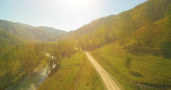 Low Altitude Flight Over Fresh Fast Mountain River with Rocks at Sunny Summer Morning