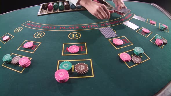 Casino Dealer Shuffles the Cards. Slow Motion. Close Up