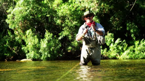 Man fly fishing in river