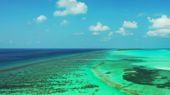 Natural overhead copy space shot of a white paradise beach and aqua blue ocean background in 4K