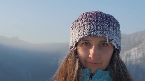 Slow Motion Portrait of a Young Attractive Frozen Woman.