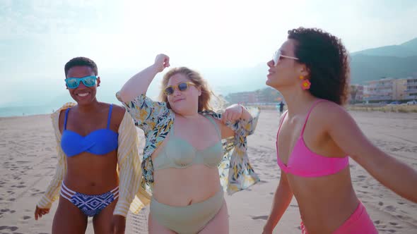 multiethnic young women having fun on the beach