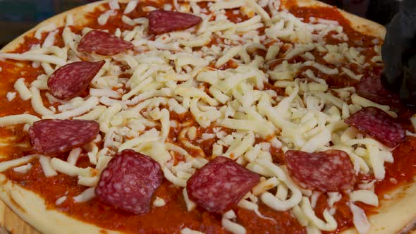 Close Up View of a Man Chef Cooking Italian Pizza