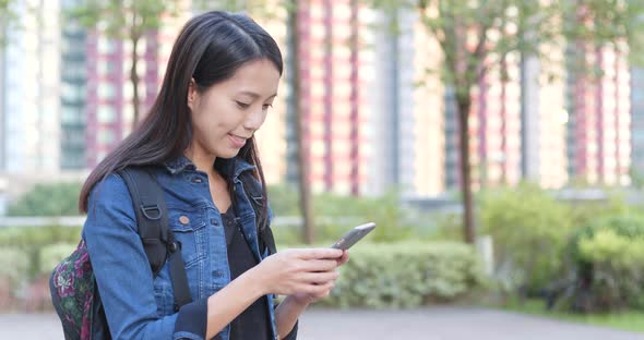 Woman Use of Smart Phone in The Park