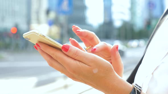 Businesswoman using smartphone in city