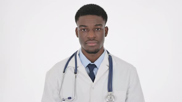 Serious African Doctor Looking at the Camera on White Background