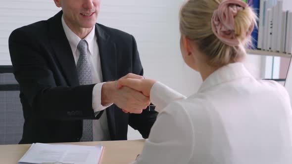 Job Seeker and Manager Handshake in Job Interview