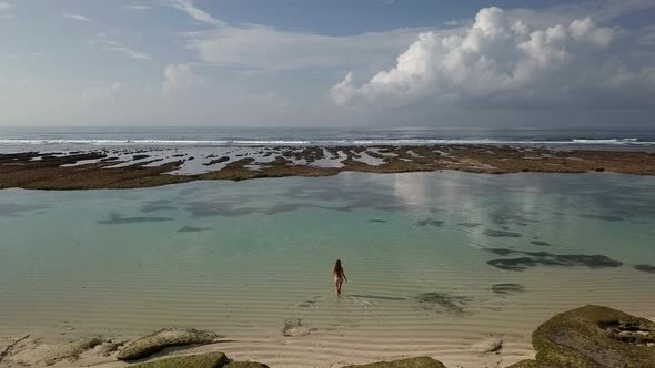 Girl in Bikini with Long Hair Going To the Sea.