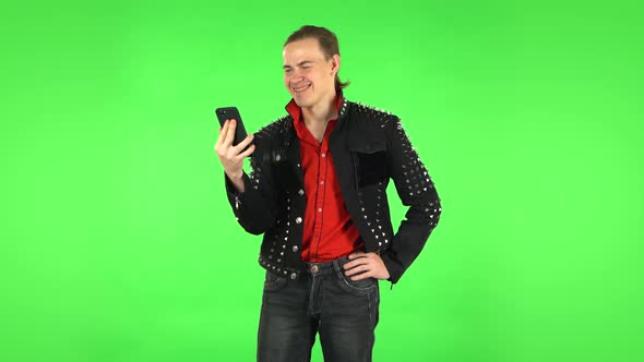 Guy Girl Talking for Video Chat Using Mobile Phone, Green Screen