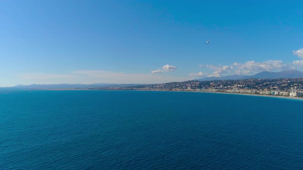 Plane Landing in Nice Airport. Mediterranean Sea and Airport View. Timelapse