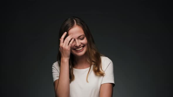 Portrait of Young Beautiful Caucasian Woman Laughing and Smiling at Camera