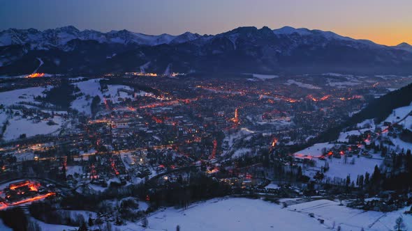 Stunning dusk over zakopane city in winter, aerial view