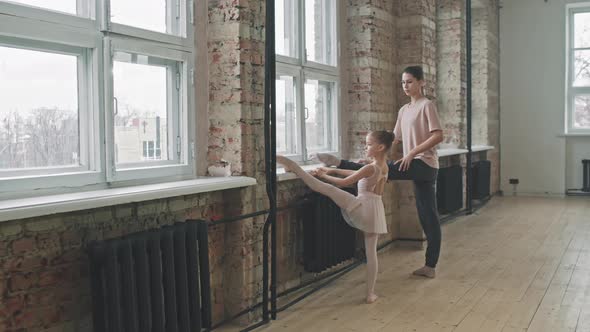 Little Girl Stretching At Ballet Class