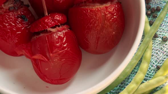 Gemista or traditional Greek stuffed tomatoes in a white bowl