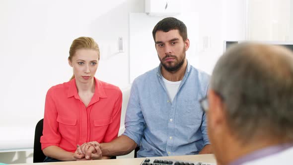 Couple Visiting Doctor at Family Planning Clinic 