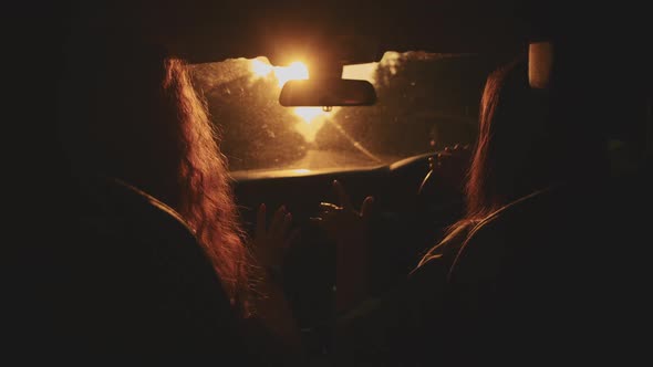 Two Happy Female Woman Friends Enjoy Travel in Car