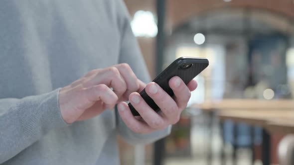 Close Up of Hands Using Smartphone