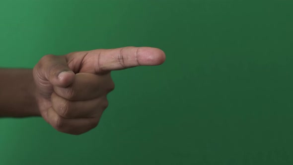 Left Hand Of UK Asian Male Pointing Finger. Angle View, Green Screen, Locked Off