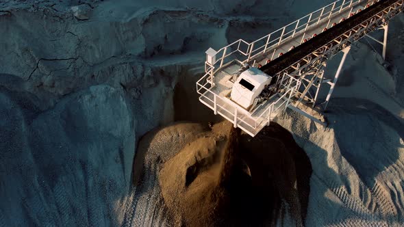 Aerial Top Down of Coal Conveyor Belt Piling Up Coal at a Depot