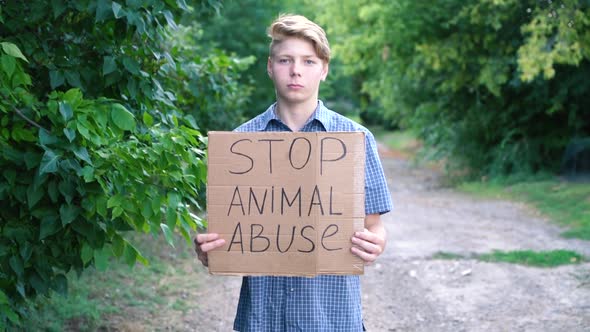 a Young Teenager of Caucasian Ethnicity a Man in a Blue Shirt Drzhin on Outstretched Arms in Front