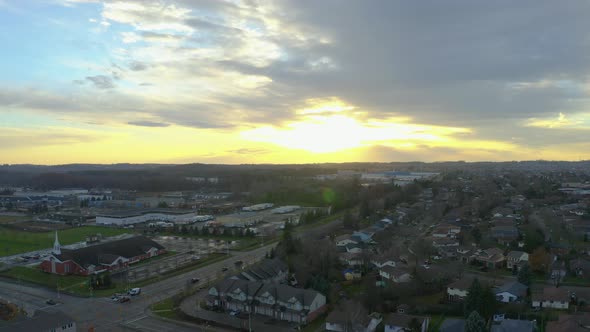 Drone descends over suburban Kitchener, Ontario homes at sunset