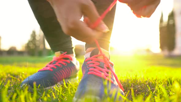 Running Shoes  Woman Tying Shoe Laces