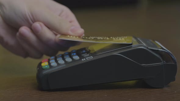 Close-up Shot of Person Using Mobile Payment PayPass