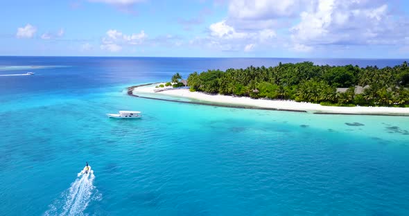 Natural birds eye abstract shot of a white sandy paradise beach and aqua turquoise water background 