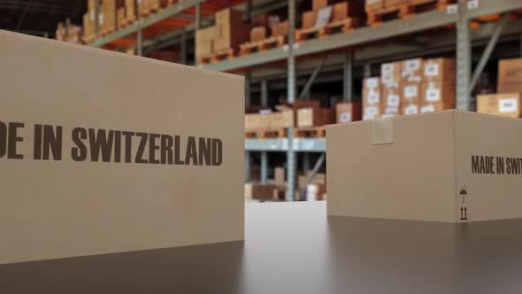 Boxes with MADE IN SWITZERLAND Text on Conveyor
