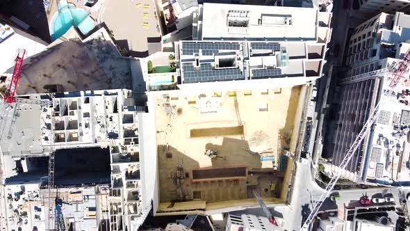 Deep hotel building foundations in downtown of St. Paul Bay, Malta. Aerial top down view