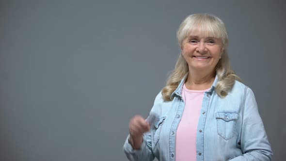 Cheerful Senior Lady Showing Pills, Effective Heart Medication, Antiviral Drugs