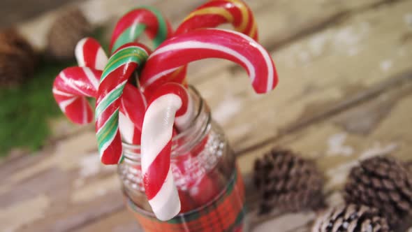 Candy canes arranged in a jar