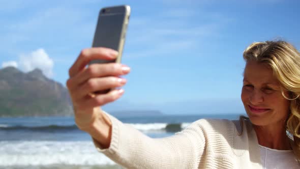 Mature woman taking a selfie from mobile phone