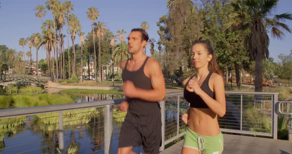 Athlete Couple Jogging In The Park