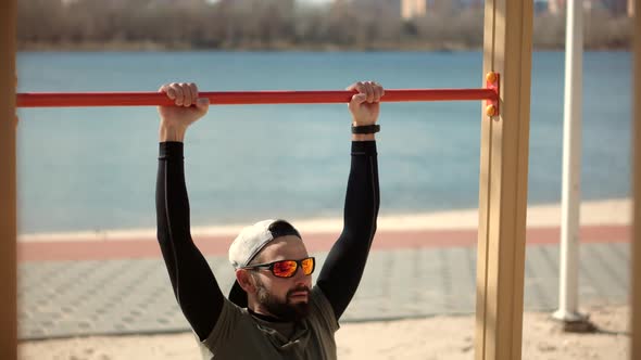 Workout Outdoor On Public Gym. Fit Athlete Street Workout. Sport Outdoor Activity Training.