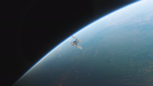 Animation of the International Space Station ISS Floating in Orbit Above Planet Earth in Outer Space