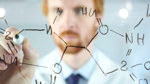 Scientist Writing Chemical Formula on Transparent Glass