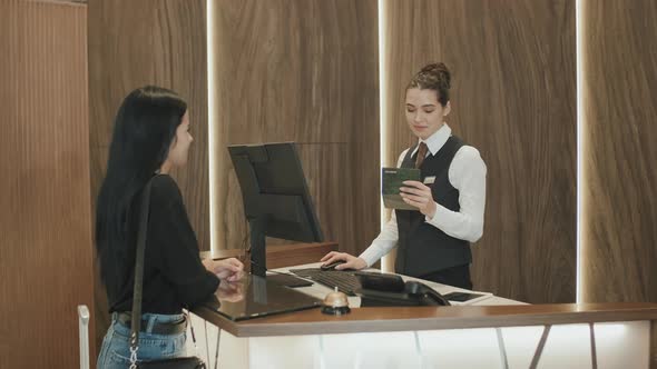 Lady Checking-In at Hotel